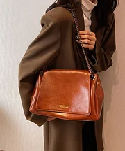 Classic brown faux leather tote bag with chain hook.